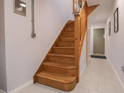 a staircase in a house with wooden steps at The Duckhouse in Shrewsbury