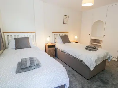 two beds sitting next to each other in a bedroom at Borthwen in Barmouth