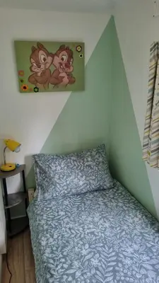 a bedroom with a bed and a painting on the wall at Turtle Lodges 29 - Riverside in Builth Wells