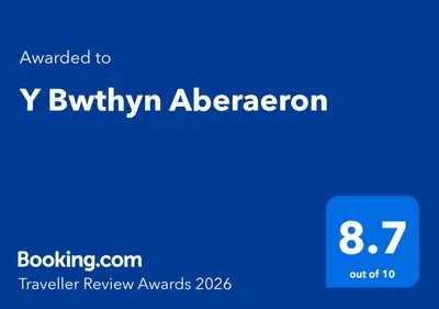 a blue screen with the text upgraded to y binyin abererno at Y Bwthyn Aberaeron in Aberaeron