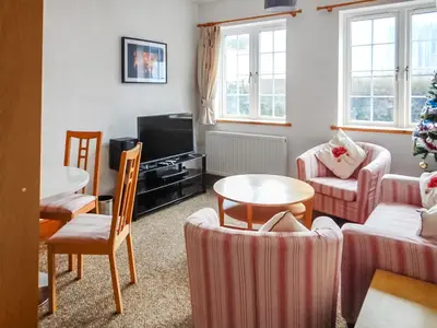 a living room with a christmas tree in it at The Annex At Is Y Coed in Welshpool