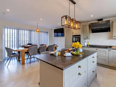 a kitchen and dining room with a dining table at 4 Bed in Bishops Castle 94072 in Bishops Castle