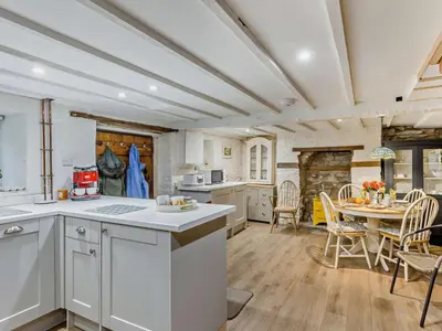 a kitchen and dining room with a table and chairs at 2 Bed in Brecon oc-92729 in Brecon