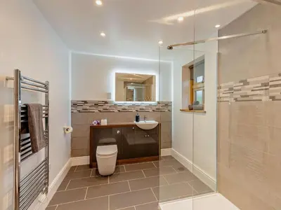 a bathroom with a toilet and a sink and a shower at 2 Bed in Craven Arms oc-94099 in Clun