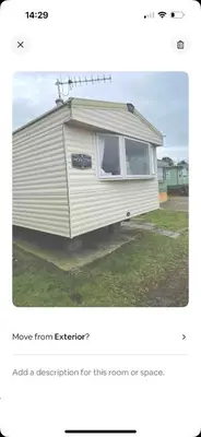 an image of an rv parked in a yard at AJ’s Caravan Hire in Aberystwyth