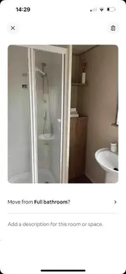 a bathroom with a shower and a sink at AJ’s Caravan Hire in Aberystwyth