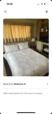a bedroom with a large bed with at AJ’s Caravan Hire in Aberystwyth