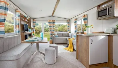 a kitchen and living room in a caravan at WH - Smugglers Cove 01 in Aberaeron