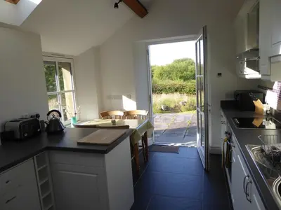 a kitchen with a sink and a counter top at Ty Cellin Tregaron in Ystrad-Meurig