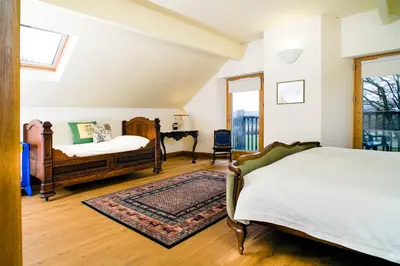 a bedroom with a bed and a desk in it at Bryn Isaf Tregaron in Ystrad-Meurig