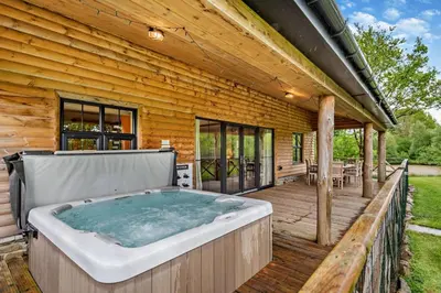 a hot tub on the deck of a house at 4 Bed in Rhayader oc-m28919 in Nantmel