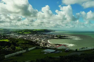an aerial view of a city and the ocean at Soar Cottage Aberystwyth in Aberystwyth