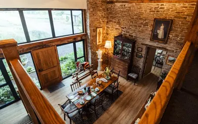an overhead view of a living room with a table and chairs at The Granary Wales in Kington