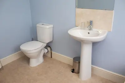 a bathroom with a toilet and a sink at Townhouse Aberystwyth in Aberystwyth