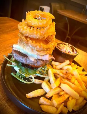 a plate of food with a sandwich and french fries at Aleppo Merchant Inn in Carno