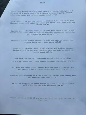 a typed document on top of a clipboard at Aleppo Merchant Inn in Carno