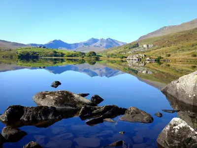 a view of a lake with mountains in the background at Llety Cariad in Bala