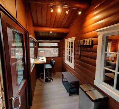 an interior of a tiny house with wood paneling at Serene Snowdonia Retreat in Trawsfynydd