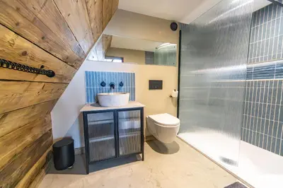 a bathroom with a sink and a toilet at The Tri-Pod in Llanarth