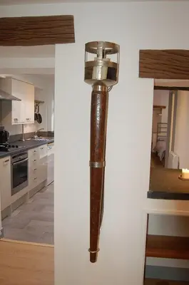 a pipe hanging on a wall in a kitchen at Ty Del - Beautiful Home in Tywyn in Tywyn
