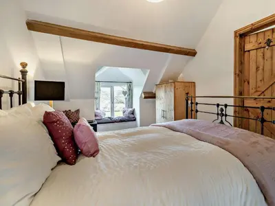 a bedroom with a large white bed with pillows at 2 Bed in Llanwrtyd Wells 94009 in Beulah