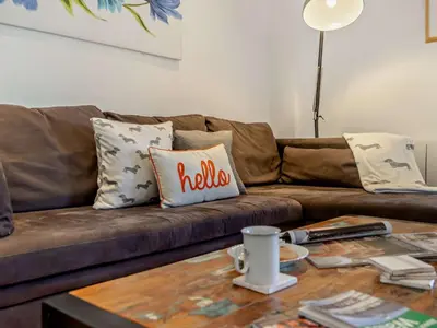 a living room with a brown couch with pillows on it at 2 Bed in Llanwrtyd Wells 94009 in Beulah