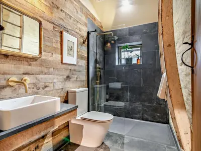 a bathroom with a sink and a toilet and a shower at 3 Bed in Brecon oc-94434 in Velindre
