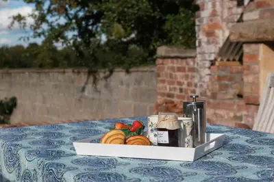 a plate of bread and fruit on a table at The Hop Kiln in Leominster