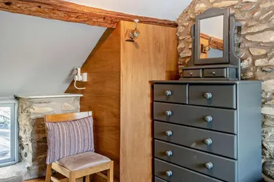a bedroom with a dresser with a tv on top at 2 Bed in Cross Inn oc-t29117 in Cross Inn
