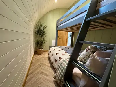 a bedroom with a bunk bed in a house at Willow in Llanidloes