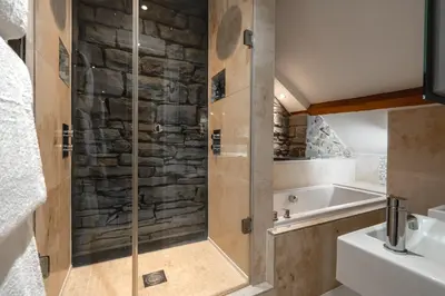 a bathroom with a shower and a sink at Gwesty Cymru in Aberystwyth