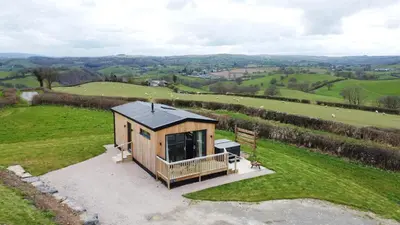 an overhead view of a tiny house in a field at Cae Bedw in Newtown
