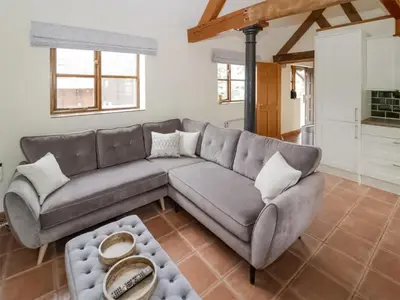 a living room with a couch and a table at Uk46555 - Ragleth in Church Stretton