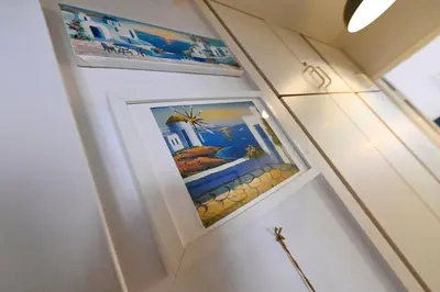 a bathroom with two pictures on the wall at Relaxing Aberdovey Retreat, close to beach in Aberdyfi