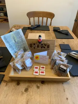 a wooden table with a tray of cards on it at Mountain views in the heart of Brecon Town in Brecon