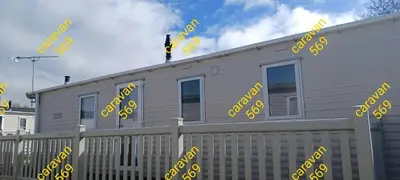a house with yellow dollar signs on the side of it at Sean's 569 cader court 045 in Talybont