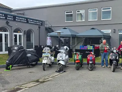 a group of motorcycles parked in front of a building at The Springfield Hotel in Fairbourne