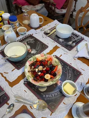 a table with a bowl of food on top of it at Twyford Homestay B&B in Llandrindod Wells