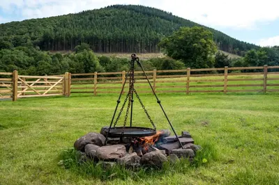 a fire pit in the middle of a field at 1 Bed in Talybont-on-Usk oc-a29348 in Talybont