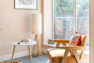 a living room with a chair and a lamp at 1 Bed in Craven Arms oc-o29275 in Craven Arms