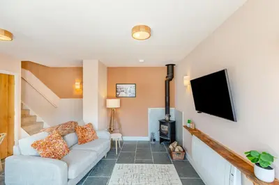 a living room with a couch and a flat screen tv at 1 Bed in Craven Arms oc-o29275 in Craven Arms