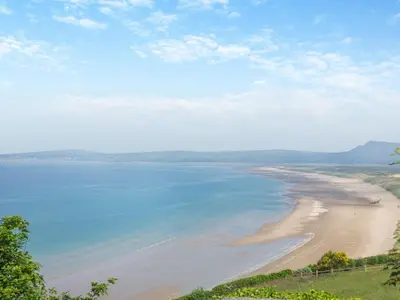 a view of the beach from a hill at Goppa in Llanfair