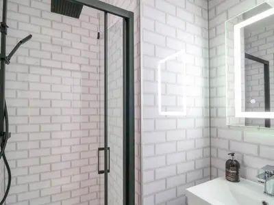 a bathroom with a shower and a sink at Pondarosa in Llandrindod Wells