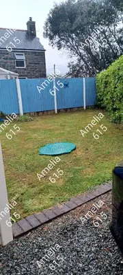 a sign in the grass with writing on it at Amelia 615 Barmouth in Talybont