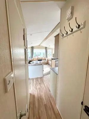 an open door to a kitchen and a living room at MoonStone in Aberystwyth