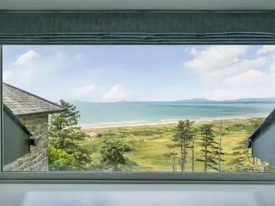 a window view of the ocean from a house at Valerian Lodge in Harlech