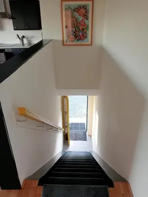 a stairway leading up to the top of a stair case at The Slow House Apartments, Llandefalle in Brecon