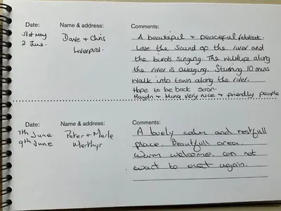 a notebook with handwriting on a white paper at Cwt Bugail Aeron in Aberaeron
