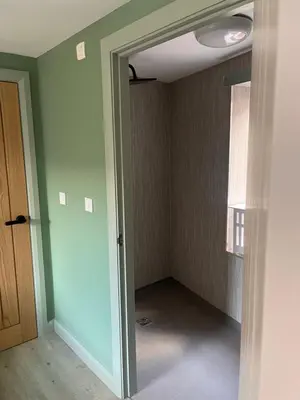 an empty room with a door and a window at Tumbledown Hotel in Shrewsbury