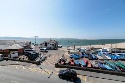 a group of boats are docked at a marina at Modern Sea View Apartment in Aberdyfi